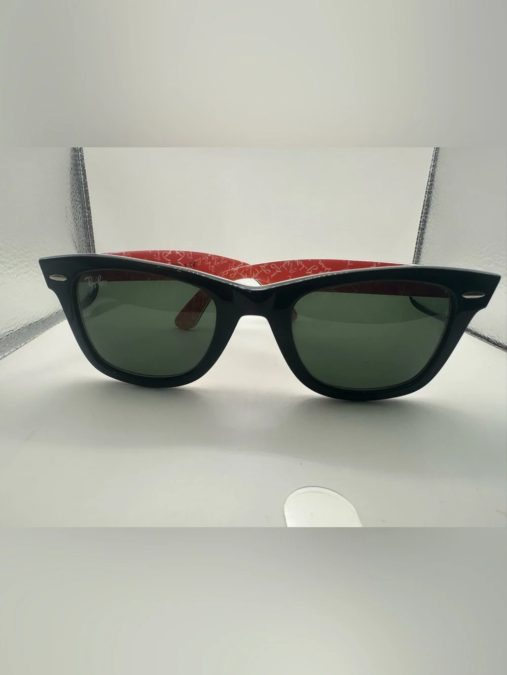 Ray-Ban Black Frame Sunglasses with Red Temples and Green Lenses